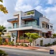 Architectural Symphony in White and Charcoal: Duplex Elevation with a Modern Twist