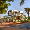 Modern White Duplex Elevation Design with Wooden Accents