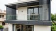 Close-up of 40x60 north facing G+1 facade design — cantilevered balcony, vertical fins, cladding panel