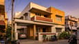 3D elevation of a modern west-facing G+1 home on a 40x60 plot with warm evening light on the facade