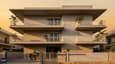 Contemporary 40x60 G+2 west-facing home with layered balconies and stone cladding facade lit by evening golden hour light