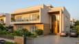 Modern north-facing 60x60 G+1 home with clean contemporary facade and landscaped front setback
