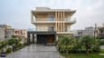 3D elevation of a 60x60 north facing G+2 home with modern facade and landscaped entrance