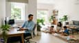 Young family in modern ground-floor home with home office, north-facing window, light interiors