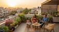 Evening lifestyle view from the second-floor sunset terrace of a 40x50 west facing G+2 house in an urban Indian neighbourhood