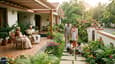 A multi-generational Indian family enjoying morning time in the front garden of their south-facing single-floor home, with a wide verandah visible and warm morning sunlight