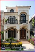 Mediterranean style 30 feet front elevation featuring stucco walls, terracotta roof tiles and arched doorways